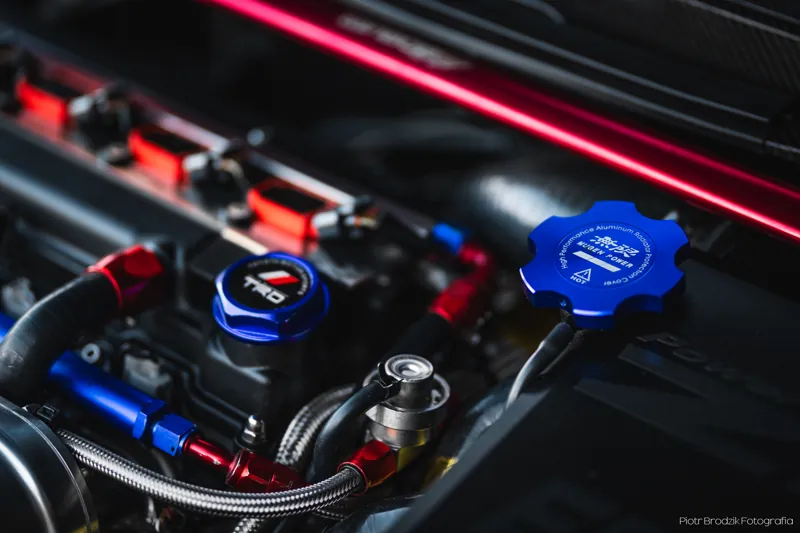 Engine bay — valve cover and plumbing